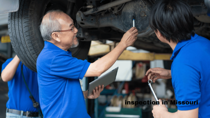 senior asian mechanic teaching junior inspecting a car
